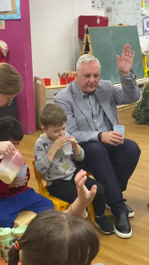 Children and a teacher celebrating The Great British Milk Break at Monkey Puzzle Day Nurseries in Bexleyheath.